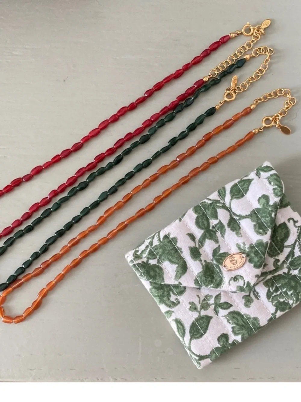 Sezane Flora Earrings, Amandine Bracelet and Clem Necklace
Color: Carmine Red - Picture 12 of 14